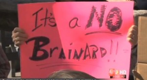 Protester holds anti-Brainard sign at Grand Junction City Hall